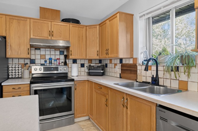 Kitchen with island and wood cabinetry