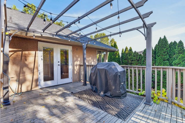 Covered deck overlooking the backyard